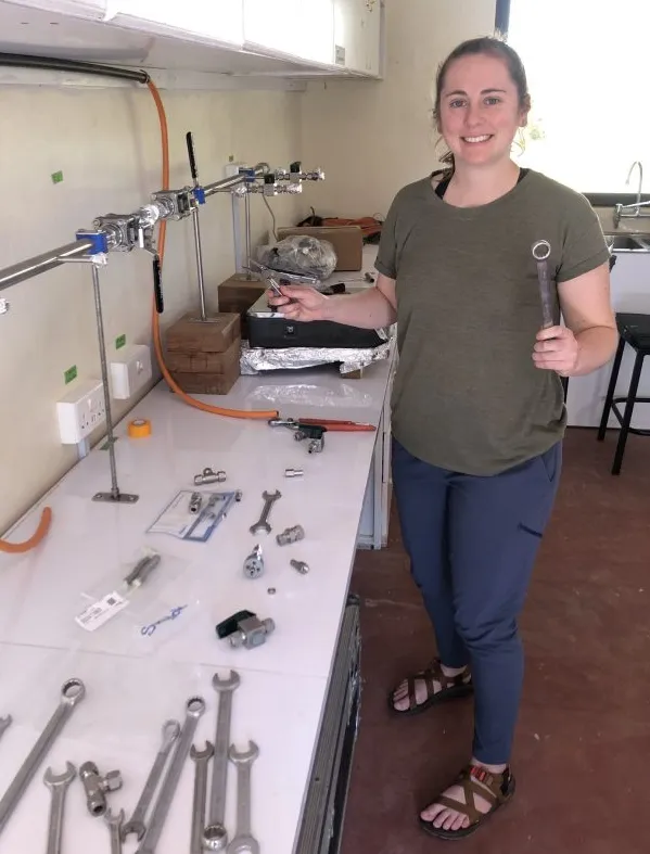 Rachel Lupien, a Lamont-Doherty postdoc funded by the Center for Climate and Life, setting up a lab for isotope analyses at the Mpala Research Center in Kenya. (Image: Kevin Uno)