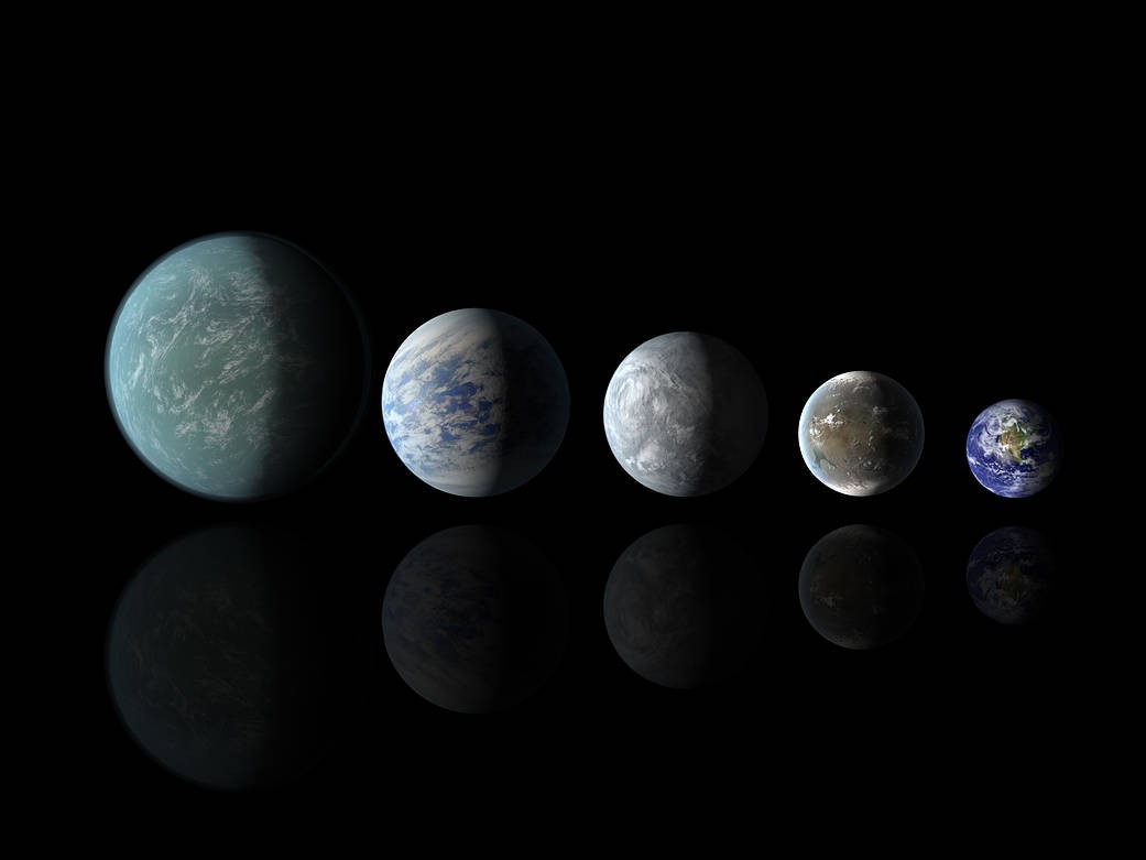 Relative sizes of Kepler habitable zone planets discovered as of April 18, 2013. Left to right: Kepler-22b, Kepler-69c, Kepler-62e, Kepler-62f, and Earth (except for Earth, these are artists’ renditions). Image and caption courtesy of NASA Ames/JPL-Caltech.