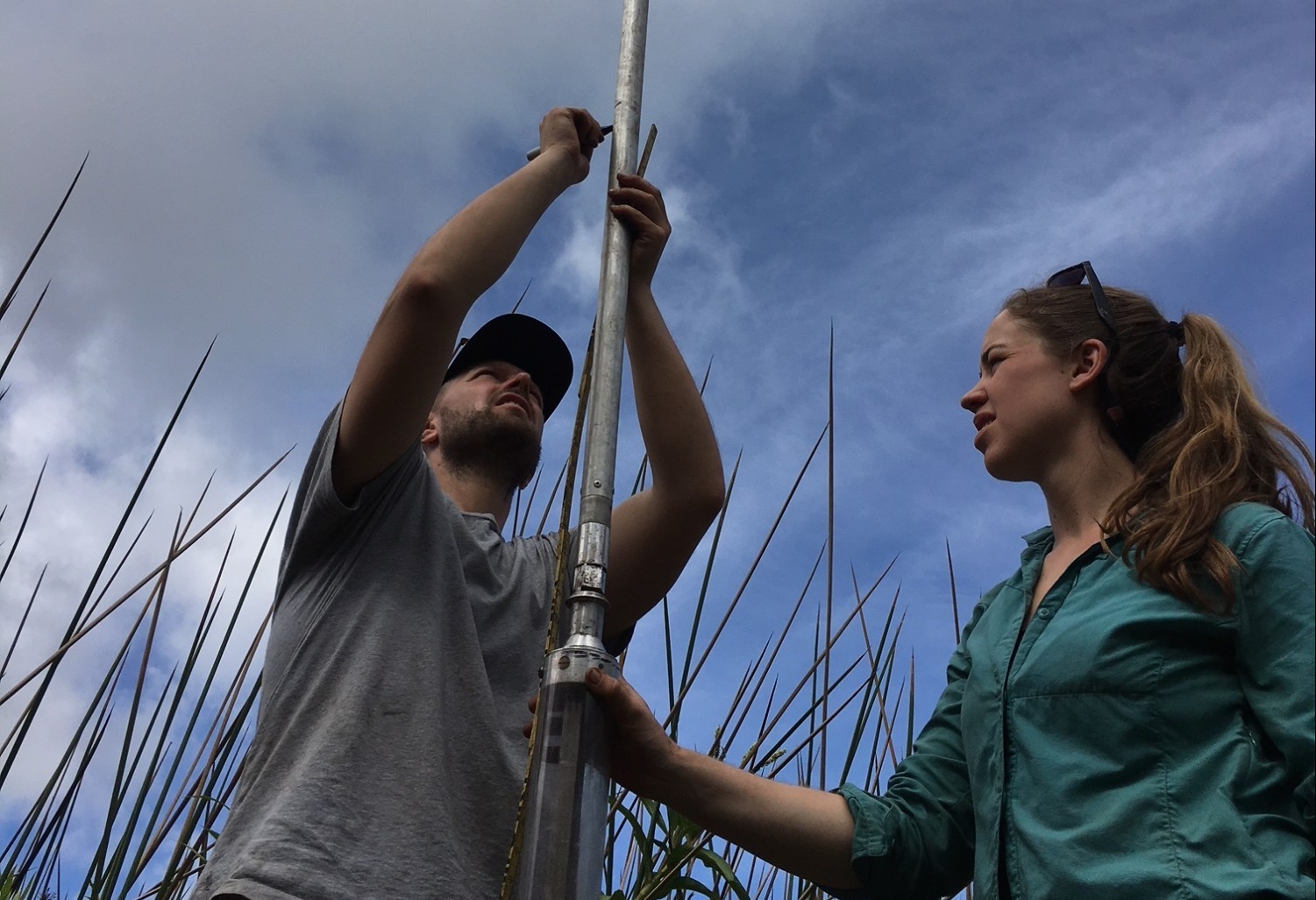 Billy D’Andrea and graduate student Lorelei Curtin prepare to collect a sediment core in Rano Aroi, Rapa Nui. (Photo courtesy of Billy D’Andrea)