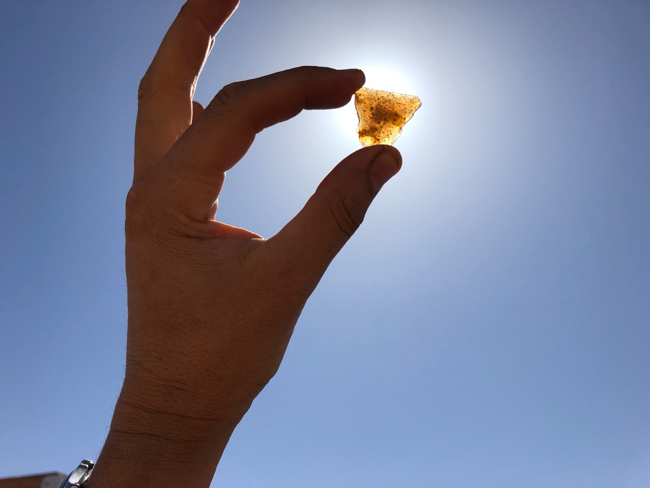 A rare, translucent cryptocrystalline quartz flake from a stone tool at Gobero. (Photo: Kevin Uno)