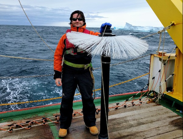 Pierre Dutrieux in Terra Nova Bay, Antarctica with an instrument that detects fluctuations in ocean water. (Courtesy Pierre Dutrieux/Lamont-Doherty Earth Observatory)