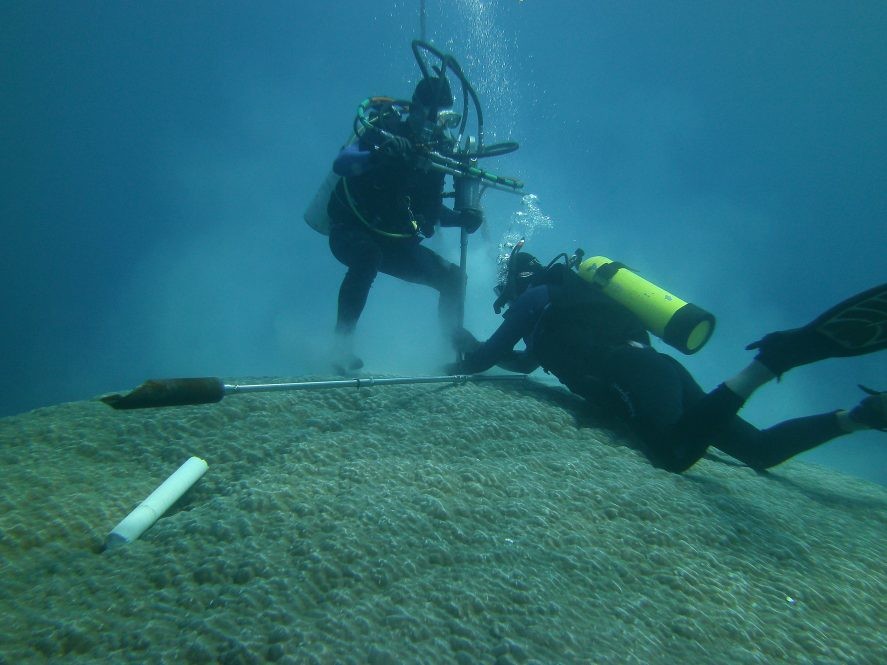 Scientists collect coral reef core samples near American Samoa. (Photo: Brad Linsley)